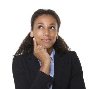 Smiling business woman thinking